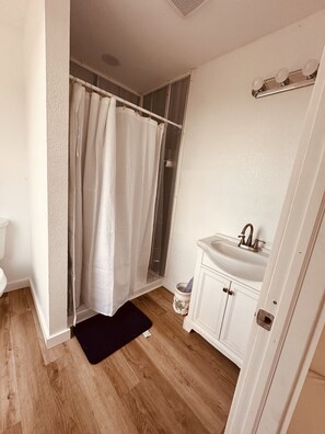 Shower, towels, soap, toilet paper
