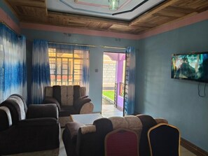 Appartement Deluxe, balcon, vue jardin | Coin séjour