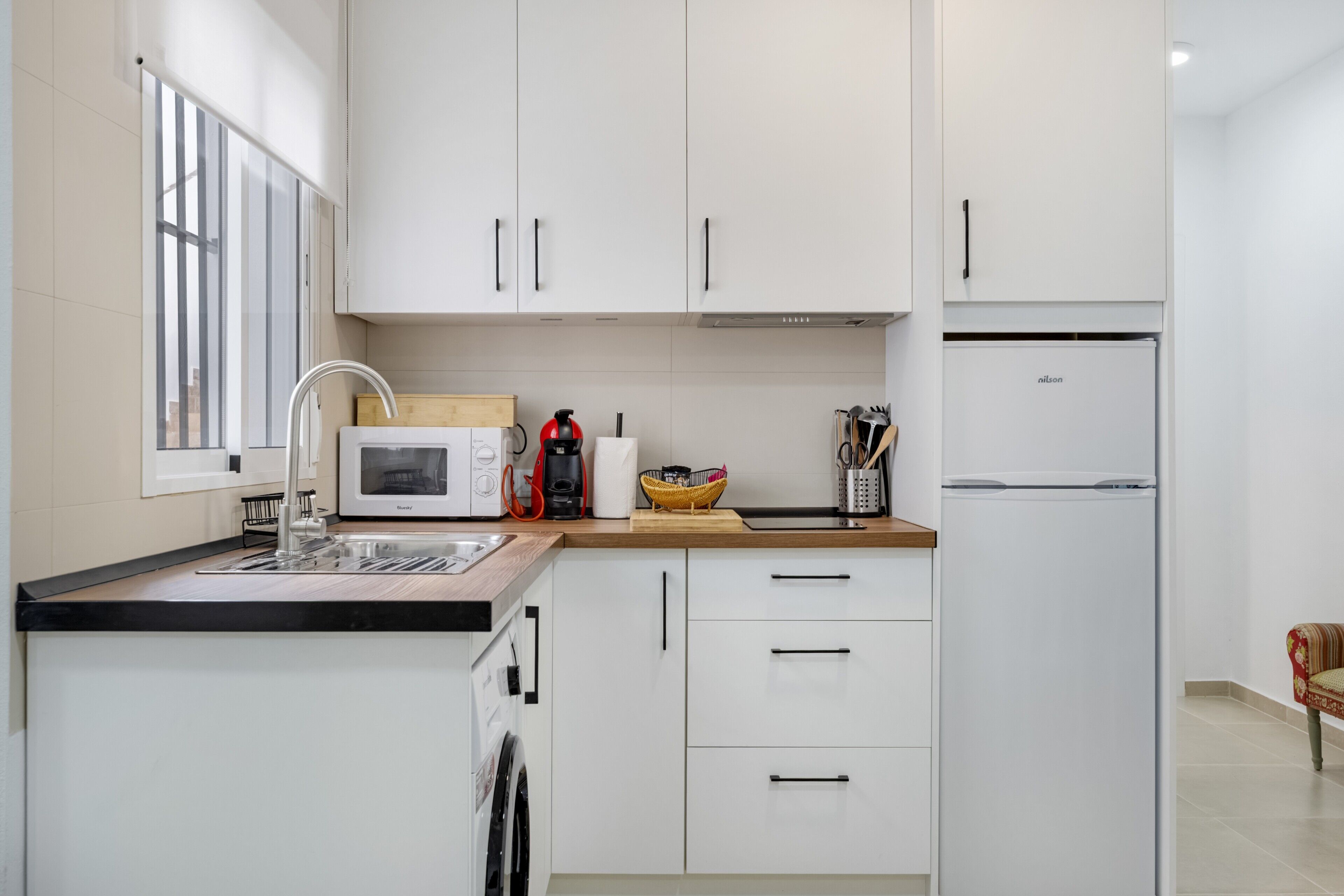 Fridge, microwave, stovetop, coffee/tea maker