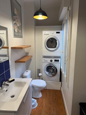 Shower, hair dryer, towels, toilet paper