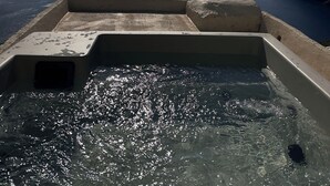 A pool with a view of the sea and distant mountains. - Kamari Real Living, with Caldera views and Jacuzzi (Manolas)
