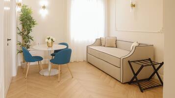 Luxury Quadruple Room, Balcony, City View | In-room safe, laptop workspace, iron/ironing board, free WiFi