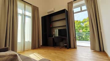 Deluxe Suite | Living area | 43-inch Smart TV with digital channels