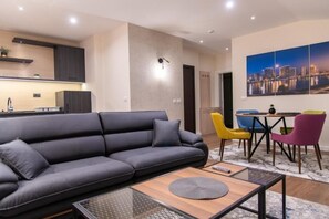 Deluxe Penthouse, Balcony, City View | Living area | 53-inch Smart TV with cable channels, TV - Hotel Maksimum (Belgrade)