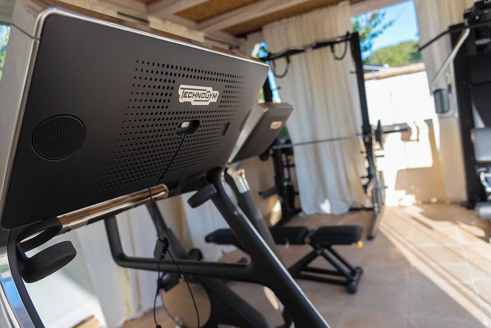 An exercise bike with a visible brand logo and a control panel.