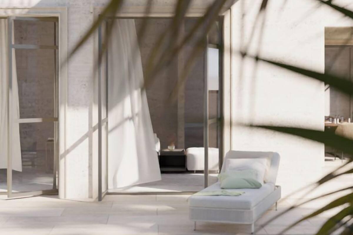 Un immeuble résidentiel moderne à plusieurs niveaux, doté d’un espace piscine.