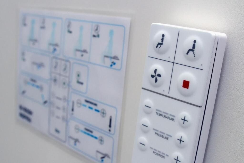 A control panel with various settings and indicators, including temperature, pressure, and position controls.