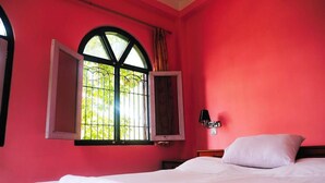 A room with a bed, a window with open shutters, and a wall-mounted lamp. - Peaceful, Charming- bedroom bed & breakfast in lovely Dhulikhel #1 (Dhulikhel)