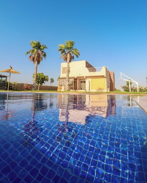 Outdoor pool, pool umbrellas, pool loungers