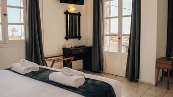 Classic Triple Room, Balcony, Ocean View | In-room safe, desk, laptop workspace, blackout drapes