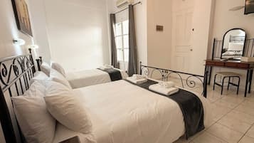 Basic Triple Room, Balcony | In-room safe, desk, laptop workspace, blackout drapes