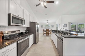 Fridge, microwave, oven, stovetop - Navigate Stays Rotonda West New-Build Pool Retreat (Rotonda West)