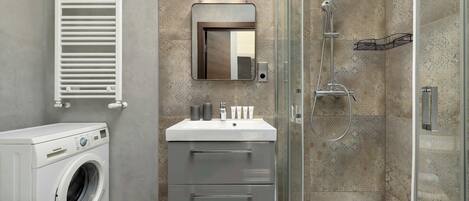 Shower, hair dryer, towels, shampoo