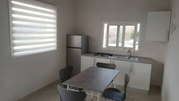 Fridge, stovetop, coffee/tea maker, cookware/dishes/utensils