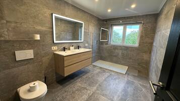 Shower, hair dryer, towels, toilet paper