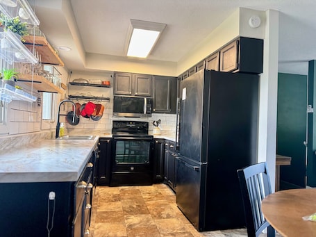 Fridge, microwave, oven, stovetop. Charming 3-bedroom house in Brooklyn