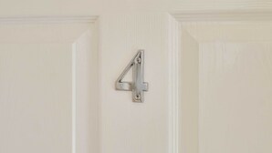 A door with a metallic number 4 handle. - Host & Stay | Ross's View, Second Floor, Apartment 4 (Whitby)