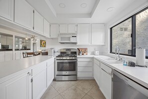 Fridge, microwave, stovetop, coffee/tea maker - Portola Pointe - Spacious Spanish Style Condo in Los Pueblos with Koi Filled Lag (Palm Springs)
