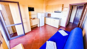 Apartment, Sea View (Bilocale) | Living area - Residence Hotel La Pelosetta (Stintino)
