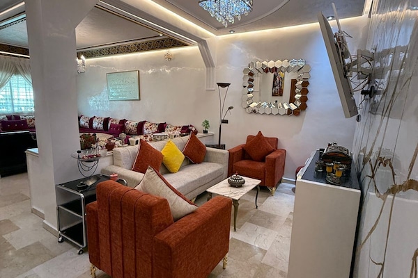 Premium Apartment, 6 Bedrooms, Balcony, City View | Living area | Flat-screen TV