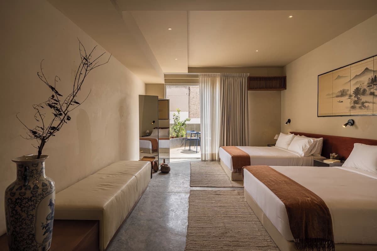 Deluxe Room, 2 Queen Beds, Courtyard View | In-room safe, desk, laptop workspace, blackout drapes