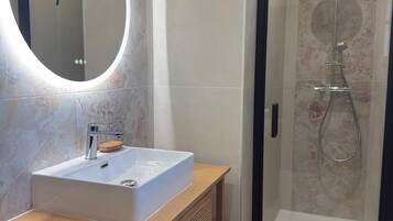 Shower, hair dryer, towels, soap