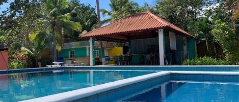 2 outdoor pools, open 6:00 AM to 10:00 PM, pool loungers