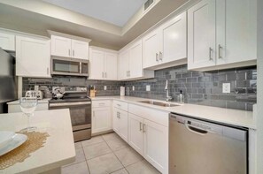 Fridge, microwave, oven, stovetop - Storey Lake Resort Condo w Patio—5 miles to Disney (Kissimmee)