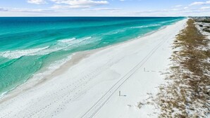 A beach with clear turquoise waters and a white sandy shore. - Gulf Getaway with Private Pool and LSV (Santa Rosa Beach)