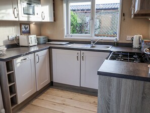 Cottage | Private kitchen | Dishwasher, cookware/dishes/utensils - Fern Lodge With Hot Tub (Stowmarket)