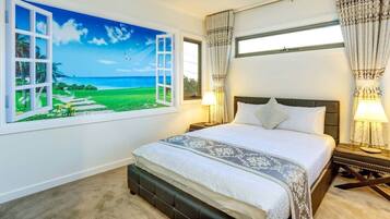 A bedroom with a large window, a bed with a headboard, two bedside lamps, and a nightstand.