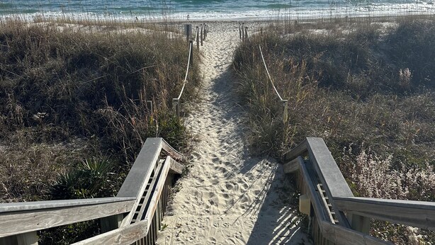 A wooden boardwalk leading to a beach with a clear view of the ocean. - Cozy 1-bedroom, 1.5 bathroom condo in Emerald Isle with FANTASTIC ocean views! (Emerald Isle)