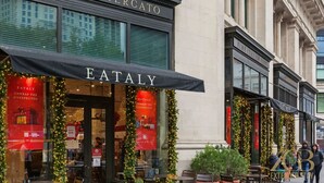 A storefront with 'EATALY' signage and festive decorations. - Spacious 3BR Flex 4 with Washer & Dryer in NoMad (New York)