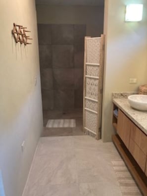A bathroom with a shower, a sink, and a towel rack. - Villa Upper Deck!  (Cabo San Lucas)