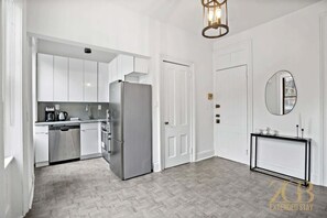 Fridge, microwave, oven, stovetop - Sun-Filled Brownstone Apt in Prime Chelsea (New York)