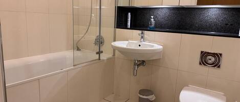 Shower, hair dryer, towels, toilet paper