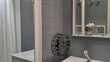 Shower, hair dryer, towels, soap