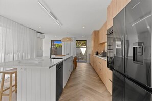 Private kitchen - Premium Home with Sauna & Parking - Steps to Beach (Mount Maunganui)