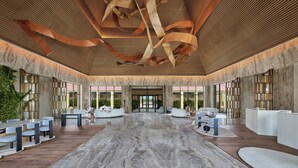 A spacious lobby with a high ceiling, large windows, and a central seating area. - The Westin Jaipur Kant Kalwar Resort And Spa (Amer)