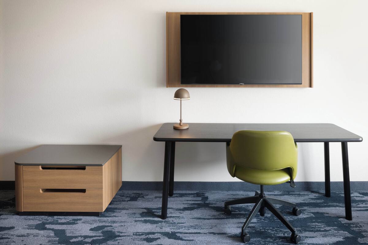Premium bedding, desk, laptop workspace, blackout curtains