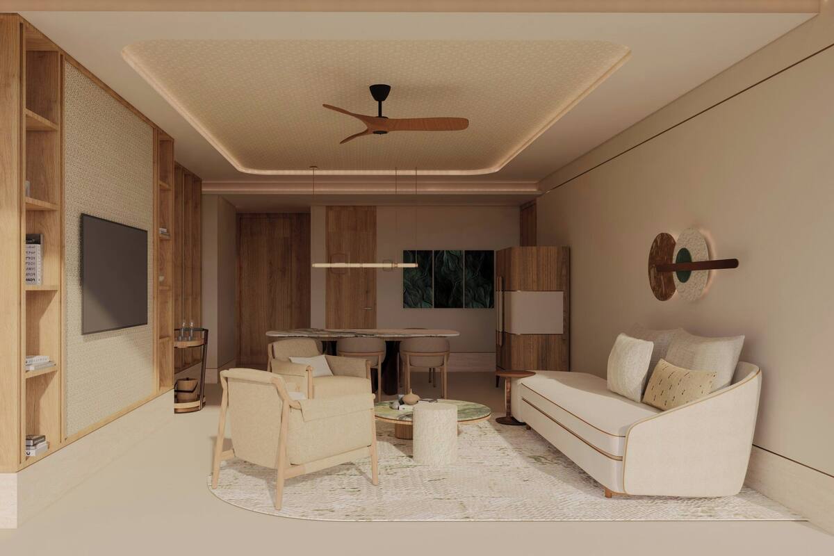 A modern living room with a ceiling fan, a flat-screen TV, a dining table, and a sofa.