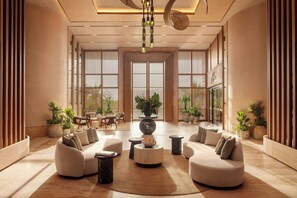 A spacious lobby with a central seating area, large windows, and potted plants. - The St. Regis Costa Mujeres Resort, Cancun​ (Cancun)