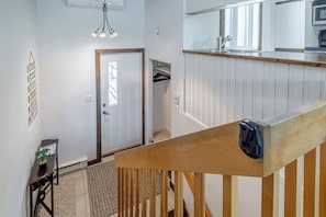 A modern kitchen with a wooden countertop, a built-in oven, and a stainless steel sink. - Superb condo facing the slopes of Ski Stoneham! (Stoneham-et-Tewkesbury)