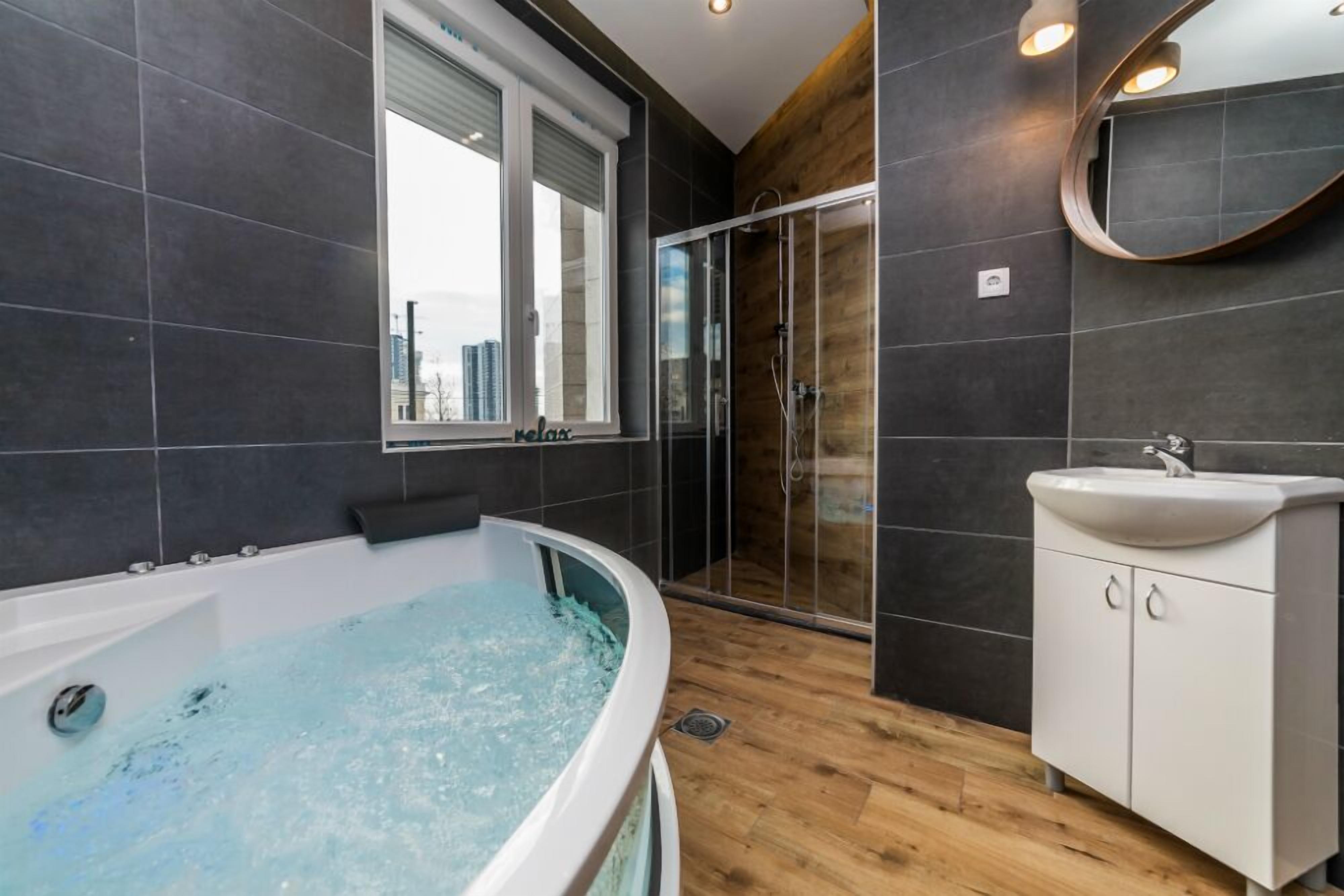 Family Apartment | Bathroom | Hair dryer, towels, soap, toilet paper