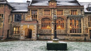 A historic building with a stone facade, arched windows, and a central entrance. - Citylink Central Flat 1 (London)
