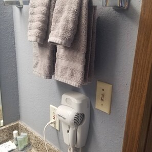 Hair dryer, towels, soap, toilet paper