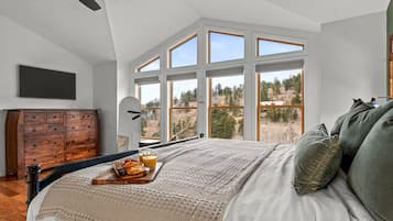 Tabla de planchar con plancha, wifi y ropa de cama