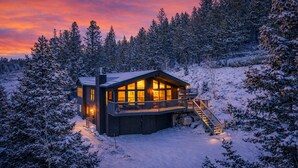 A cabin with a balcony, surrounded by snow-covered trees. - Mountain View Retreat - Game Room + 2 Living Areas (Black Hawk)