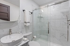 Shower, hair dryer, towels, soap
