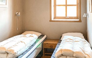 A small, single-room with two single beds, a window, and a bedside table. - Awesome apartment in Lindesnes with WiFi (Lindesnes)